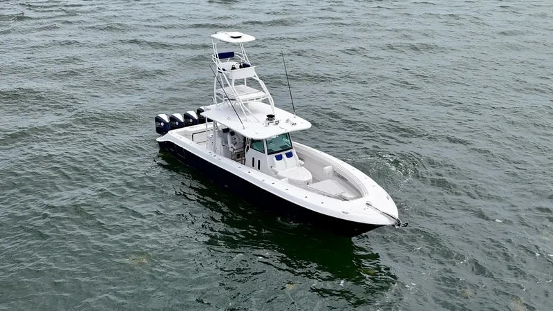 Slide: The Image of Aerial View of Center Console This 2018 Hydra-Sports 4200 Siesta, named 'Yo No Se', showcases a sleek center console design and powerful quad outboard engines. The spacious deck layout is ideal for both fishing and leisure, featuring a well-equipped helm and ample seating. The elevate - 7030844
