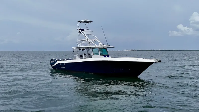 Slide: The Image of Side Profile of 4200 Siesta This image showcases the sleek side profile of the 2018 Hydra-Sports 4200 Siesta. The vessel features a sturdy T-top design, providing shade and protection, while the spacious deck layout promises ample room for both relaxation and fishing activities. Its - 7030842