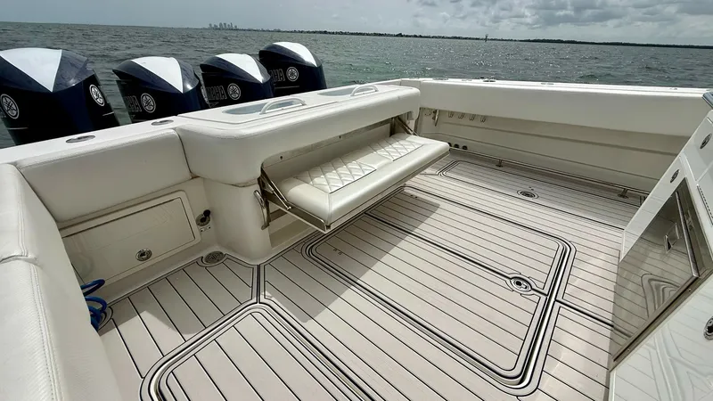 Slide: The Image of Spacious Aft Deck with Fold-Down Seating This expansive aft deck on the 2018 Hydra-Sports 4200 Siesta features a versatile fold-down seat, perfect for relaxation or additional passenger space. The sleek, non-slip decking ensures safety and comfort, while the well-integrated storage compartments - 7030836