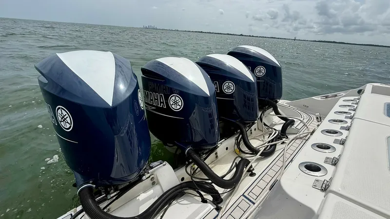 Slide: The Image of Quad Yamaha Outboard Engines View This image showcases the powerful quad Yamaha outboard engines on the Hydra-Sports 4200 Siesta. The sleek design and robust performance of these engines ensure superior speed and reliability on the water. Their arrangement offers optimal balance and effic - 7030839