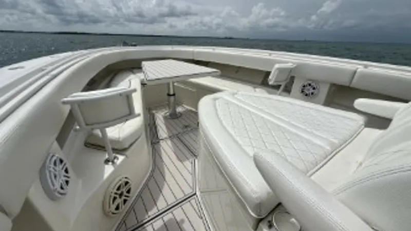 Slide: The Image of Spacious Bow Seating Area The bow of the 2018 Hydra-Sports 4200 Siesta features plush, diamond-stitched seating, offering comfort and style. Equipped with a versatile removable table, this area is perfect for social gatherings or relaxing with a scenic view. The elegant white upho - 7030828