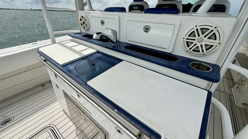 Slide: The Image of Outdoor Galley and Entertainment Center The outdoor galley of the 2018 Hydra-Sports 4200 Siesta features a sleek countertop with integrated sink and cutting board, ideal for meal preparation at sea. Equipped with high-quality speakers and ample storage, this area is perfect for entertaining gue - 7030834