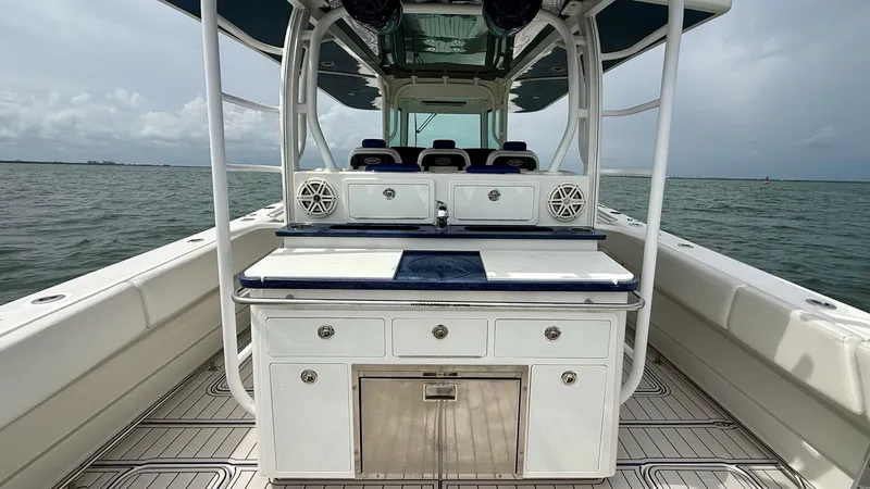 Slide: The Image of Spacious Aft Deck with Seating and Storage This image showcases the elegant aft deck of the 2018 Hydra-Sports 4200 Siesta, featuring ample seating and integrated storage solutions. The deck's design is both functional and stylish, with high-quality materials and finishes that complement the vessel - 7030833