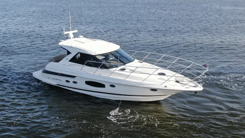 The Image of Exterior Starboard View The 2014 Regal 46 Sport Coupe exudes elegance with its sleek, aerodynamic design. The starboard view showcases the expansive windows, offering abundant natural light and panoramic views. The vessel's streamlined hull and polished finish emphasize its spor - 6857425