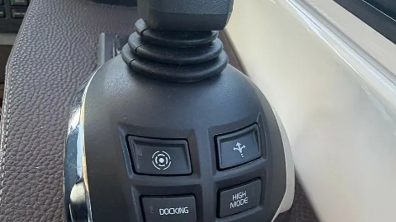 Slide: The Image of Joystick Control System The joystick control system offers intuitive handling and precision maneuvering for the 2014 Regal 46 Sport Coupe. This feature simplifies docking and navigation with easy-to-use controls, enhancing the vessel's performance. The modern design integrates s - 6857453