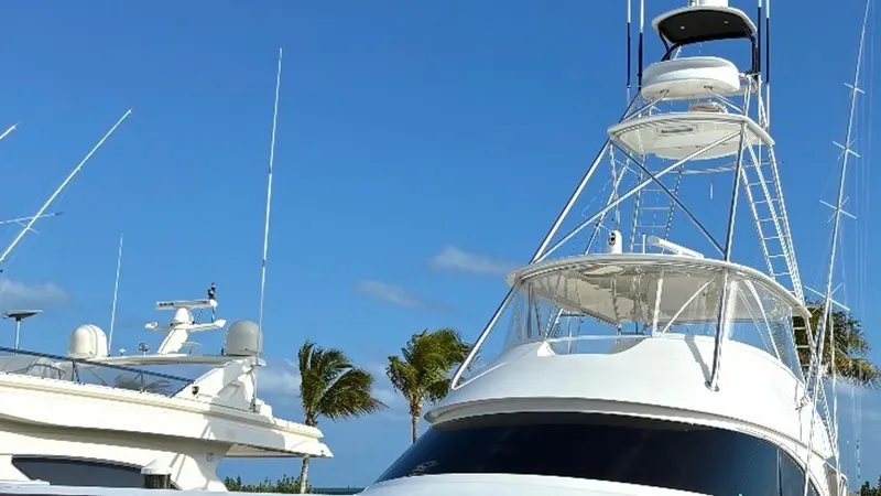 Slide: The Image of Tower and Upper Helm View The Viking 68 Convertible showcases a sleek and commanding tower with an upper helm, ideal for optimal visibility during navigation. The aerodynamic design complements the vessel's modern aesthetic, while the robust construction ensures durability and per - 6862361