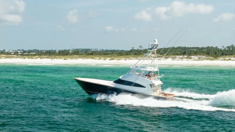 Slide: The Image of Viking 68 Convertible Cruising The 2022 Viking 68 Convertible, Tax Man, is captured gracefully slicing through vibrant turquoise waters. This sleek vessel boasts a powerful hull and an elevated tower, making it ideal for sportfishing and luxurious cruising. Its dynamic design and super - 7463840