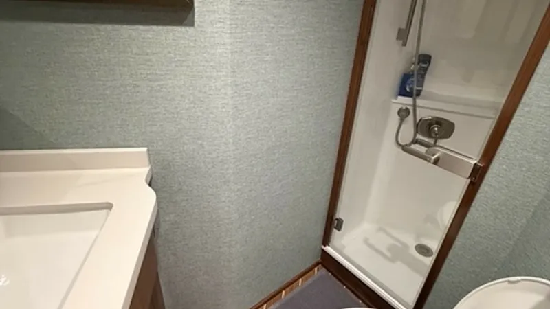 Slide: The Image of Viking 68 Convertible Forward Head Forward Head with enclosed shower and teak and holly style sole. - 6862346