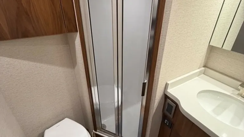 Slide: The Image of 2022 Viking 68 Convertible Crew Head Crew Head with enclosed shower. - 6862357