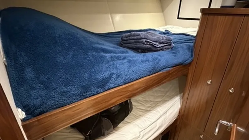 Slide: The Image of Port Guest Stateroom Twin berths with ample storage in luxurious walnut hanging lockers. - 6862348