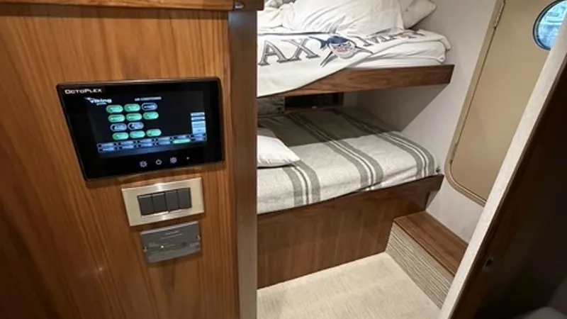 Slide: The Image of 2022 Viking 68 Convertible Crew Stateroom Crew stateroom with twin berths and Octoplex monitor. - 6862354