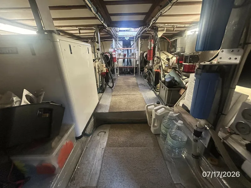 Slide: The Image of 48' Hatteras engine room forward - 6885859