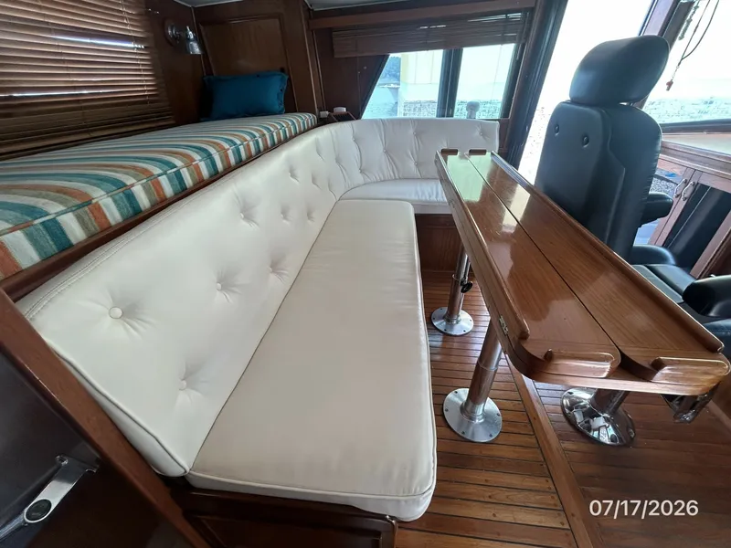 Slide: The Image of 48' Hatteras pilothouse aft seating2 - 6885907