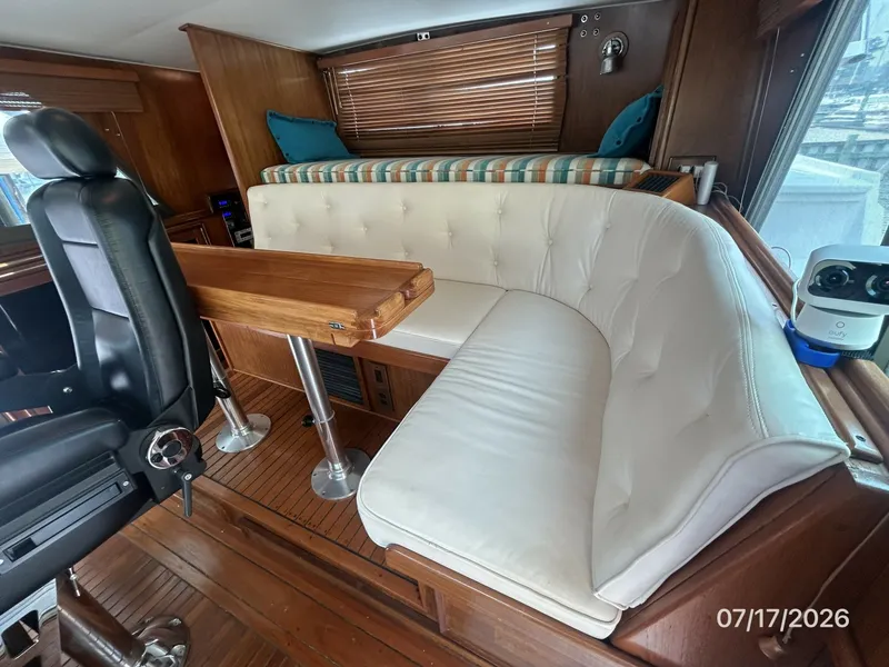 Slide: The Image of 48' Hatteras pilothouse aft seating1 - 6885906