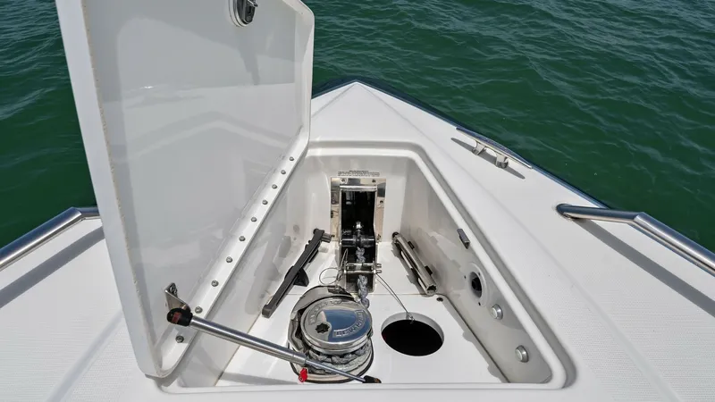 Slide: The Image of Anchor Locker Compartment View This image showcases the anchor locker of the 2022 Formula 430 Super Sport Crossover, 'Blue Agave'. The compartment is neatly designed with a hydraulic-assisted lid and ample space for secure anchor storage. The clean finish and practical layout ensure ea - 7030619