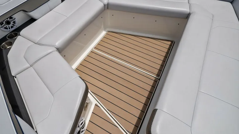 Slide: The Image of Spacious Cockpit Seating Area Experience luxury and comfort in the Blue Agave's cockpit, featuring plush wraparound seating. The high-quality upholstery and teak-style flooring create an inviting space perfect for socializing or relaxing. Integrated cup holders and sleek speaker syste - 7030620
