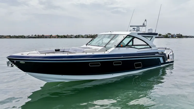 Slide: The Image of Side Profile of Formula 430 SSC The sleek and modern side profile of the 2022 Formula 430 Super Sport Crossover, 'Blue Agave,' showcases its elegant design and superior craftsmanship. The deep blue hull contrasts beautifully with the white superstructure, while large windows offer panor - 7030634