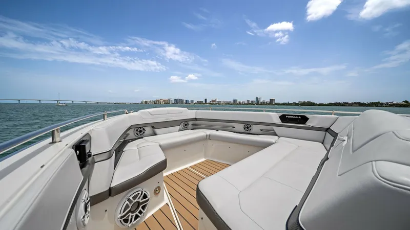 Slide: The Image of Spacious Bow Lounge Area The bow lounge of the 2022 Formula 430 Super Sport Crossover offers expansive seating with plush upholstery, ideal for relaxation and socializing. High-end marine speakers and sleek stainless-steel accents enhance the luxurious ambience. The view from thi - 7030591