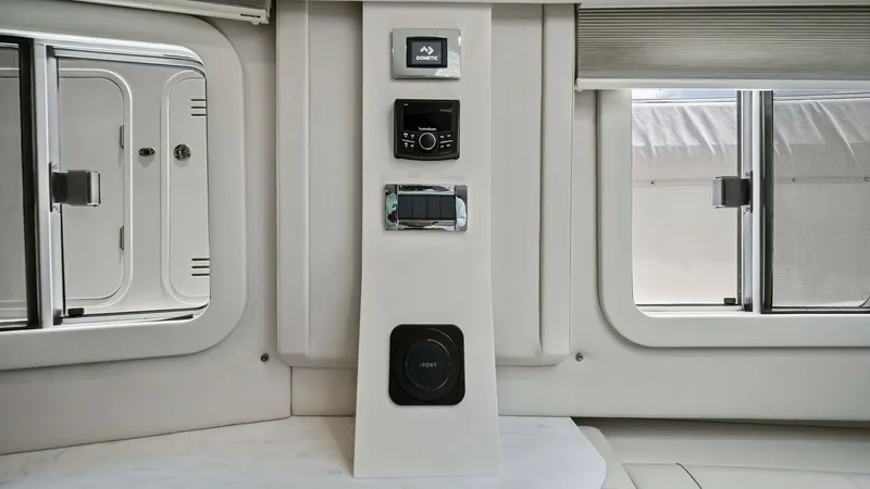 Slide: The Image of Interior Control Panel Area This image showcases the sleek interior control panel of the 2022 Formula 430 Super Sport Crossover. The panel is elegantly integrated into the cabin wall, featuring advanced controls and a modern audio system, all within easy reach. The surrounding area - 7030629