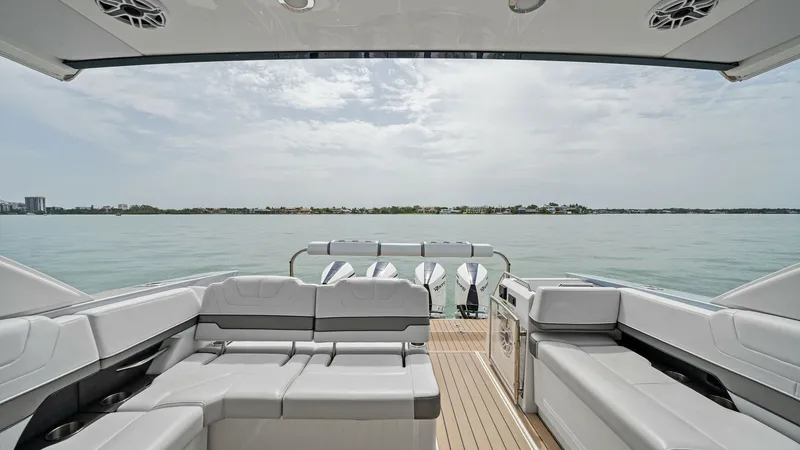 Slide: The Image of Spacious Aft Deck with Seating The aft deck of the 2022 Formula 430 Super Sport Crossover offers luxurious seating with plush, modern upholstery. The layout provides ample space for relaxation and socializing, complemented by a sleek, teak-like deck. Overhead speakers ensure an immersi - 7030601