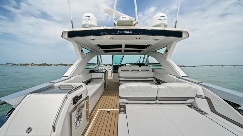 Slide: The Image of Spacious Aft Deck with Seating The aft deck of the 2022 Formula 430 Super Sport Crossover offers a luxurious and spacious seating area perfect for entertaining. High-quality upholstery and sleek design elements provide both comfort and style. The open layout connects seamlessly to the - 7030596