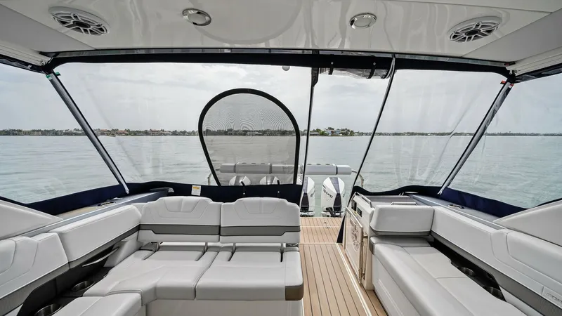 Slide: The Image of Spacious Aft Deck with Seating The aft deck of the 2022 Formula 430 Super Sport Crossover, Blue Agave, offers a luxurious open-air seating area with sleek, modern design. The plush, wrap-around seating is complemented by high-quality marine-grade upholstery and a durable teak-look floo - 7030598