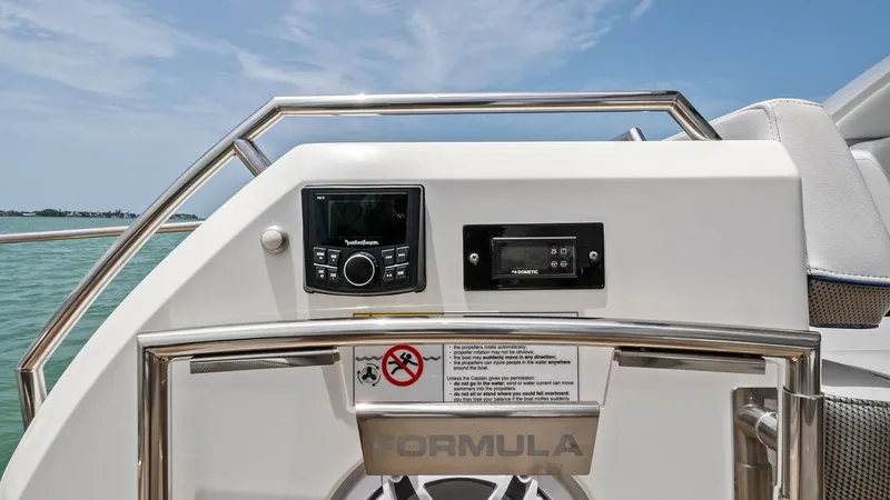 Slide: The Image of Cockpit Entertainment Control Panel The cockpit of the Formula 430 Super Sport Crossover features an advanced entertainment control panel. This area is equipped with a modern sound system and intuitive interface for seamless audio control, ensuring an enjoyable experience on the water. The - 7030609