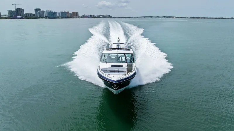 Slide: The Image of Aerial View of Bow in Motion The Formula 430 Super Sport Crossover showcases its sleek design as it glides powerfully through the water. The bow is elegantly styled, cutting through the waves with ease, while the surrounding wake highlights its impressive speed and performance. This - 7030642