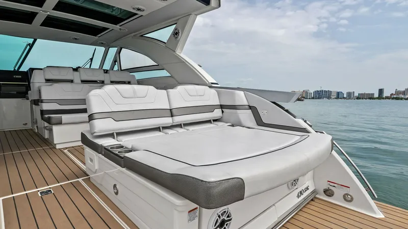Slide: The Image of Spacious Aft Deck Lounge Area The aft deck of the 2022 Formula 430 Super Sport Crossover features a luxurious lounge area with plush, contoured seating. The expansive sun pad provides ample space for relaxation, complemented by sleek, modern finishes and integrated speakers for entert - 7030592