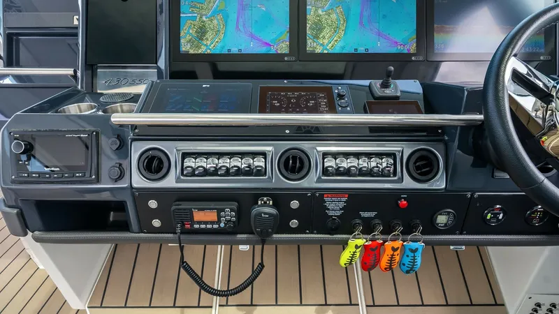Slide: The Image of Helm Station with Advanced Navigation The helm station of the 2022 Formula 430 Super Sport Crossover features a state-of-the-art navigation system with multiple high-resolution displays. The sleek dash layout includes intuitive controls, a sophisticated switch panel, and a premium steering wh - 7030612