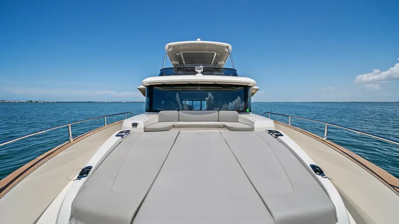 Slide: The Image of Spacious Bow Sunpad Lounge Area The bow of the 2026 Absolute Navetta 58 showcases a luxurious sunpad lounge, perfect for relaxation and sunbathing. The expansive padded area offers plush comfort, while the surrounding stainless steel rails provide safety and style. Enjoy panoramic ocean - 7018670