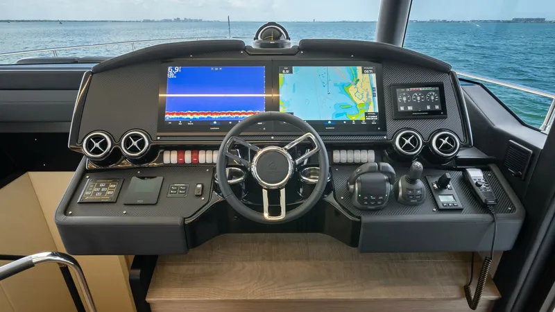 Slide: The Image of Advanced Helm Station The helm station of the Absolute Navetta 58 offers cutting-edge navigation systems with dual multi-functional displays for precise route planning. The ergonomic design includes a leather-wrapped steering wheel, intuitive controls, and elegant finishes. Ex - 7018639