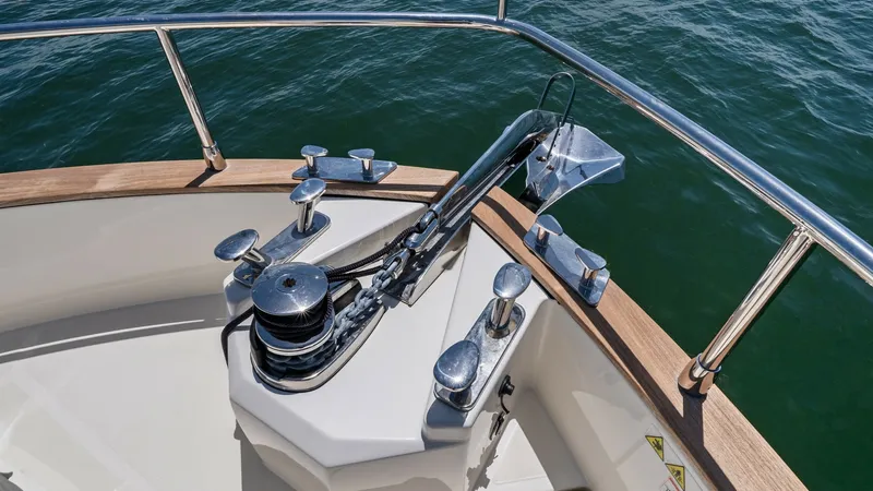 Slide: The Image of Bow Anchor System and Pulpit The bow of the Absolute Navetta 58 showcases a robust anchor system, expertly integrated into the sleek design. Stainless steel fittings and a polished pulpit enhance the vessel's modern aesthetic, while the spacious deck provides easy access for anchorin - 7018672