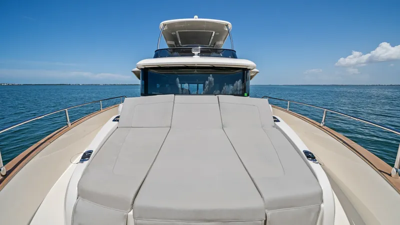 Slide: The Image of Spacious Bow Sunbathing Area The bow of the Absolute Navetta 58 showcases a luxurious sunbathing area with plush, expansive cushions. Perfectly positioned for panoramic ocean views, this space invites relaxation and leisure under the sun. The sleek design and high-quality finishes of - 7018669