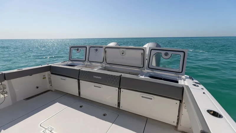 Slide: The Image of Aft Deck with Storage Compartments The aft deck of the 2023 Everglades 455 Center Console offers a spacious area ideal for both leisure and utility. This section features ample storage compartments, perfect for keeping gear organized and accessible. The sleek design and high-quality finish - 7095060