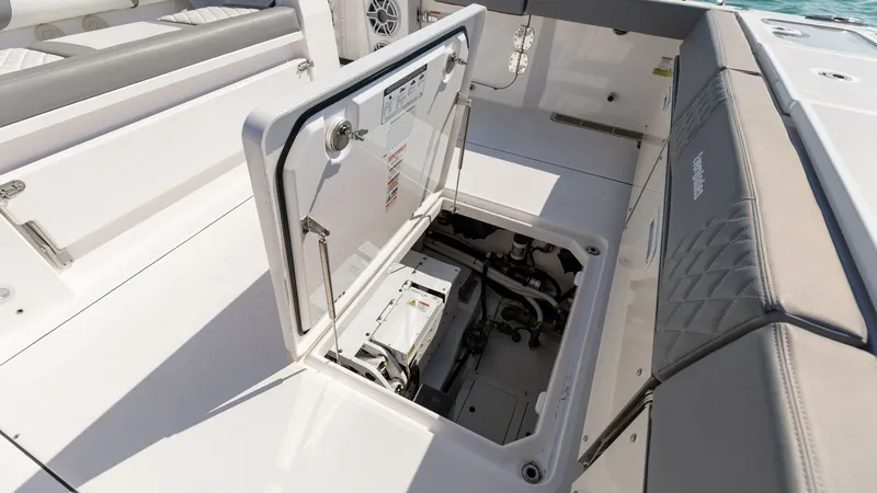 Slide: The Image of Aft Deck Storage Compartment The aft deck of the Everglades 455 Center Console features a spacious storage compartment, perfect for securing essential equipment. The compartment is seamlessly integrated with the deck, providing easy access and maintaining the vessel's sleek aesthetic - 7095079