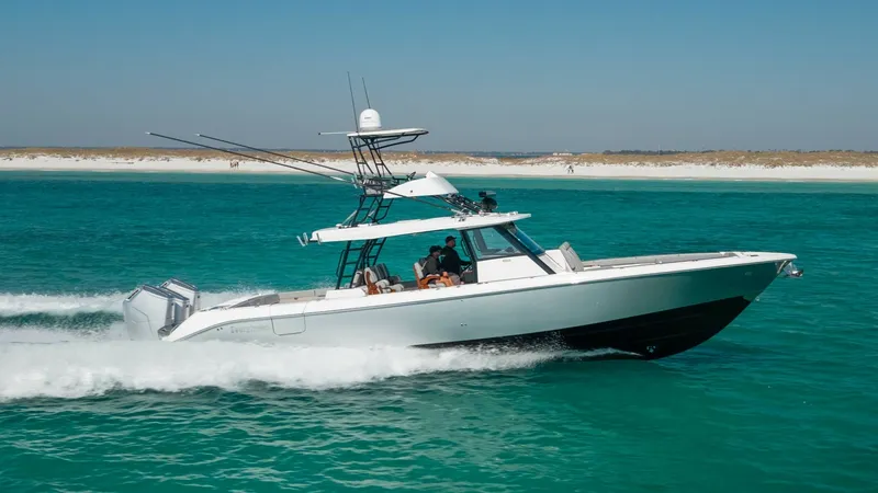 The Image of 2023 Everglades 455 Center Console- CASH COW The 2023 Everglades 455 Center Console, known as 'Cash Cow,' glides effortlessly through turquoise waters. This sleek vessel showcases its powerful outboard engines and spacious deck, ideal for both leisure and sport fishing. With its modern design and ro - 7095058