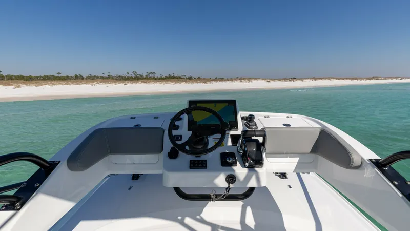 Slide: The Image of Helm Station with Panoramic Views The helm station of the 2023 Everglades 455 Center Console offers a sleek, modern design with state-of-the-art navigation technology. The expansive dashboard includes a high-resolution display and intuitive controls, ensuring a seamless boating experience - 7095087
