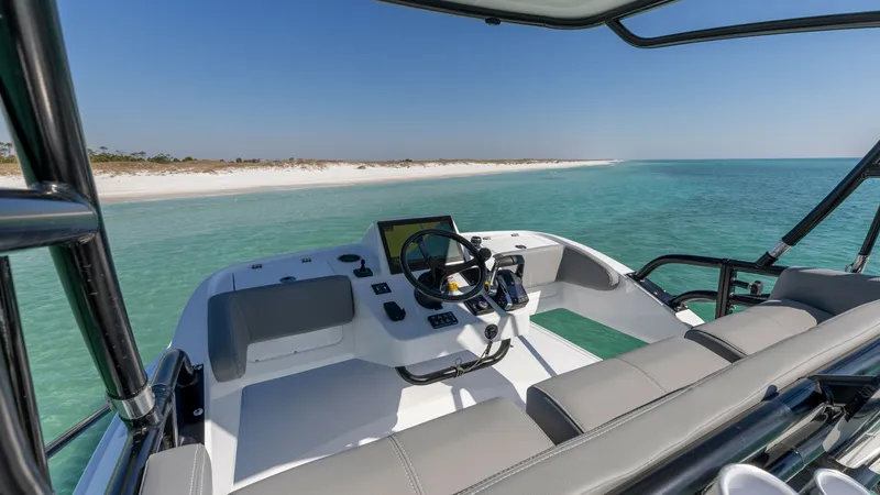 Slide: The Image of Helm Station with Dual Seating The helm station of the 2023 Everglades 455 Center Console offers a commanding view with state-of-the-art navigation technology. Dual seating provides comfort and style, while the ergonomic layout ensures easy access to controls. The open design is perfec - 7095086
