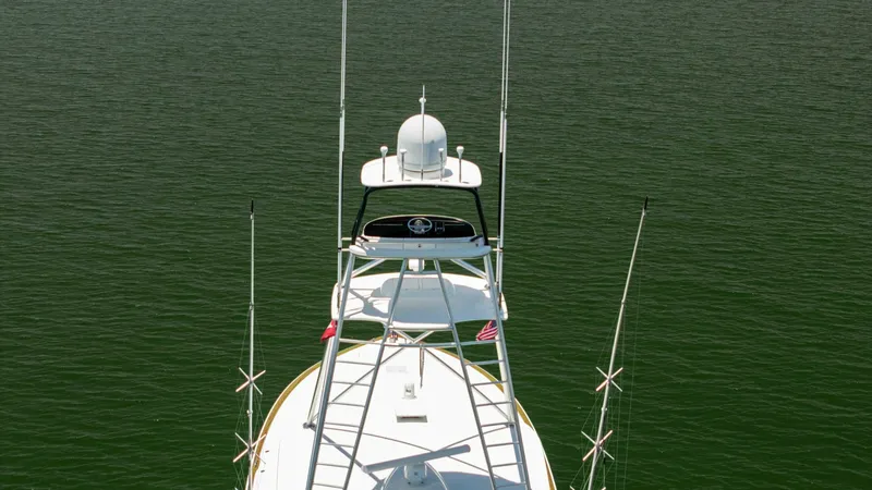Slide: The Image of Tower and Antennas View This image captures the tower of the 2016 Viking 80 Convertible, showcasing its robust antenna setup and sleek design. The tower provides an elevated vantage point, essential for navigation and fishing activities. The clean lines and advanced communicatio - 7150217