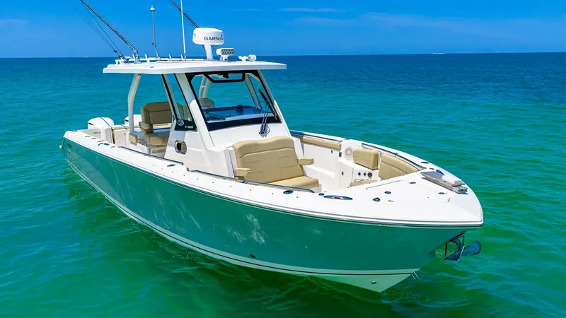 Slide: The Image of Bow and Cockpit View This image showcases the sleek bow and cockpit area of the 2019 Pursuit 328 Orcabessa. The spacious bow features comfortable seating, perfect for relaxing during a day on the water. The cockpit is equipped with advanced navigation systems, ensuring a smoo - 7095014