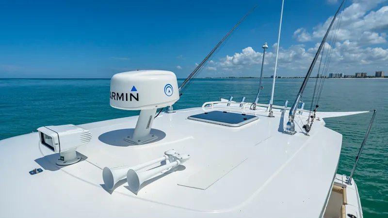Slide: The Image of Flybridge with Radar and Antennas The flybridge of the 2019 Pursuit 328 Orcabessa is equipped with advanced Garmin radar and multiple antennas, ensuring optimal navigation and communication. The sleek, white finish complements the vessel's modern design, providing a seamless blend of func - 7095017