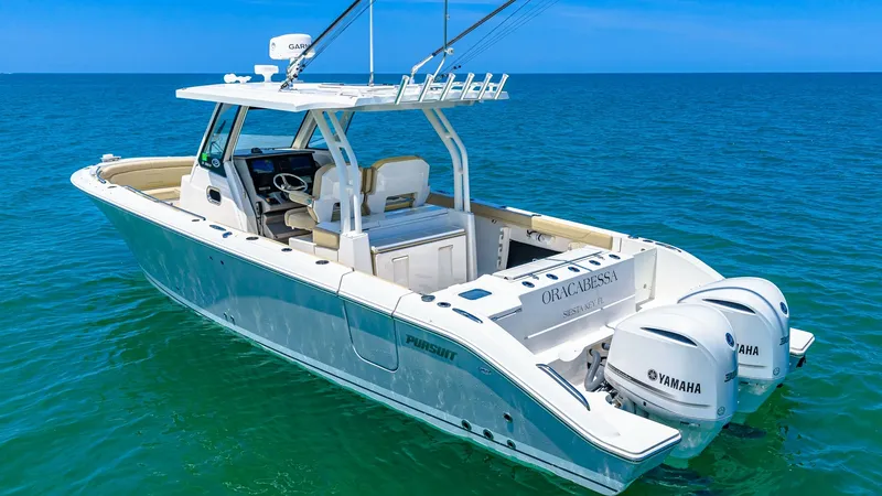 Slide: The Image of Aft Deck with Dual Engines The Orcabessa's aft deck showcases a spacious, open layout ideal for fishing or leisure activities. Equipped with twin Yamaha outboard engines, the vessel promises powerful performance and reliability. The clean, modern lines and well-organized deck space - 7095021