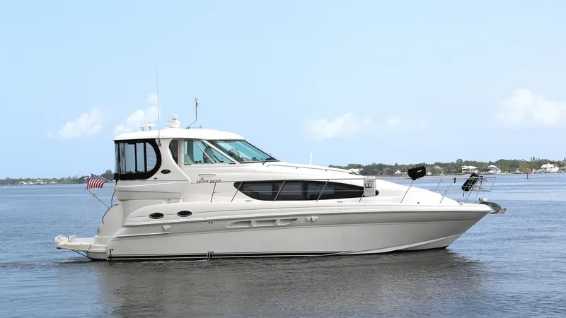 The Image of Starboard Profile of Sea Ray 40 This image showcases the sleek starboard profile of the 2006 Sea Ray 40 Motor Yacht, 'Knot on Call'. The yacht's elegant lines and spacious flybridge are complemented by large windows that provide ample natural light and panoramic views. The pristine whit - 7150621