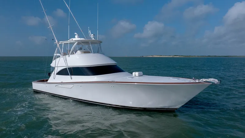 Slide: The Image of Viking 55 Convertible Exterior View The 2017 Viking 55 Convertible showcases its sleek exterior lines and robust design, cutting through the water with precision. Its pristine white hull complements the elegant flybridge, ideal for both leisure and sport fishing. The vessel's aerodynamic pr - 7180077