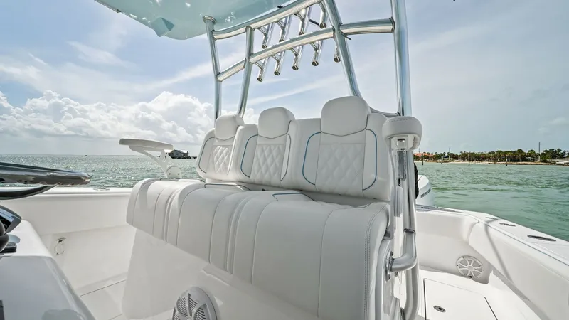 Slide: The Image of Center Console Helm Seating Area The 2024 Sea Hunter 35 Tournament features a premium helm seating area with plush, diamond-stitched upholstery, offering both comfort and style. The ergonomic design ensures a smooth ride, while the integrated rod holders above provide convenience for fis - 7094859