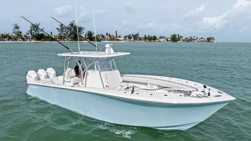 The Image of Starboard View of Sea Hunter 35 The 2024 Sea Hunter 35 Tournament is showcased here from the starboard side, highlighting its sleek hull design and powerful triple outboard engines. The spacious deck features ample seating and advanced fishing amenities, ideal for both serious anglers a - 7094858