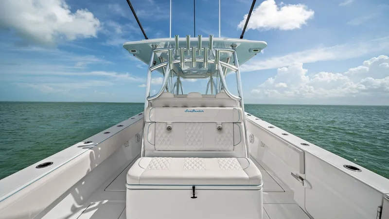 Slide: The Image of Center Console and Helm Seating The 2024 Sea Hunter 35 Tournament features a spacious center console with sleek helm seating. The seating area is designed with high-quality, diamond-stitched upholstery, offering both comfort and style. The open deck layout provides ample space for movem - 7094862