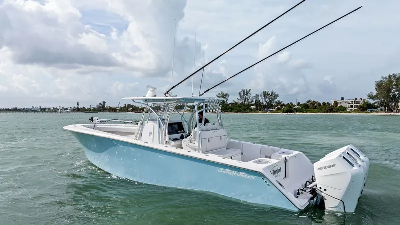Slide: The Image of Starboard View with Dual Outboards This image showcases the sleek starboard side of the 2024 Sea Hunter 35 Tournament, highlighting its aerodynamic hull design and spacious cockpit. The dual Mercury outboards promise powerful performance, ideal for offshore fishing adventures. The hardtop - 7094879