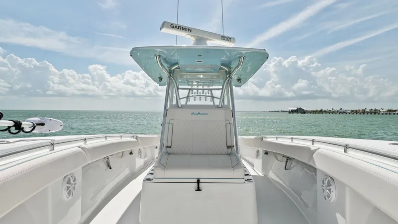 Slide: The Image of Center Console Helm and Seating This image showcases the center console of the 2024 Sea Hunter 35 Tournament. The helm features a sleek design with integrated electronics under a protective hardtop. Ample seating and clean lines enhance comfort and accessibility, perfect for both leisur - 7094872